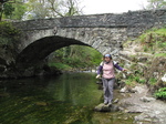 SX22213 Jenni balancing on rock by Great Langdale Beck passing through Elterwater.jpg